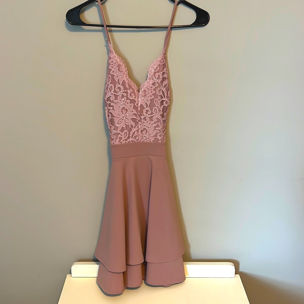 Pink dress perfect for a dance. Lace top, cross straps in back.